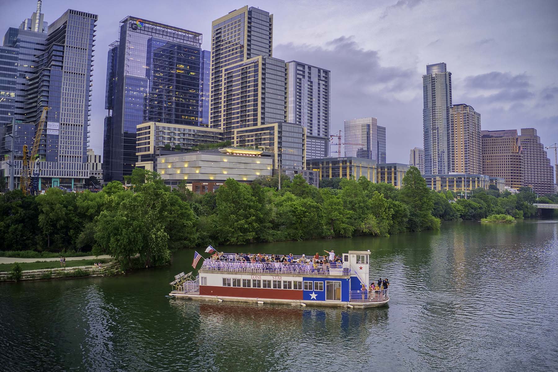 The Lone Star Riverboat on Lady Bird Lake with the Austin skyline